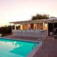 Relax with a cocktail at the poolside bar while drinking in the view.